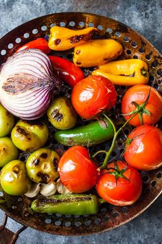 a bowl filled with lots of different types of vegetables