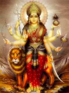 the hindu goddess with two lions and a lion in front of her, holding a staff