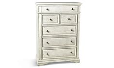 a white dresser with drawers and knobs on the bottom drawer, against a white background