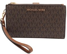 PRICES MAY VARY. Inside: 1 Large billfold, 1 Phone case slot w/ secure button closure, 1 window ID slot, 6 credit card slots & 2 multi purpose slot compartments inside Michael Kors lettering logo front center Double top zip closure & secure button closure to hold closed the wallet Size Approx. 7.25" W x 4.5" H x 1" D, w/ 7" removable wristlet strap IMPORTANT : Style Made Only For MK Outlet, Does Not Include Box or Duster Bag Inside: 1 Large billfold, 1 Phone case slot w/ secure button closure, 1 Mk Wallet, Fun Wallets, Smartphone Holder, Michael Kors Wallet, Monogram Prints, Handbags Michael Kors, Kors Jet Set, Shoulder Tote, Jet Set