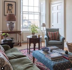 a living room filled with furniture and a large window