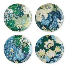 four plates with different designs on them, one blue and the other green in color