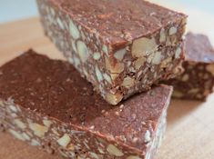 three pieces of chocolate and almond fudge on a cutting board