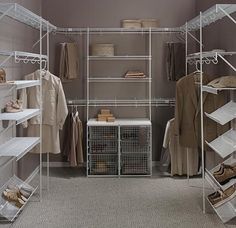 a walk in closet filled with lots of shelves and hanging racks full of clothing items