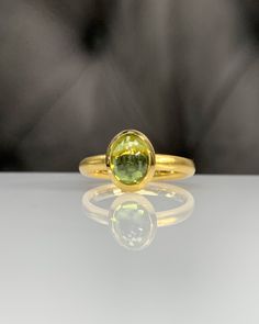 Natural Peridot Ring * Dainty Cabachon Ring * Genuine Peridot & 14K Solid Gold * Best Gift for Her/Him * Handmade Ring ◎ Details ◎ ○ Gemstone Details .Natural PERIDOT Oval Cut 9X7 mm approx. 2.01 ct ○ Gold Details 14K Solid Gold Width of Band : 2.50 mm Weight of Ring : approx 3.80 gr Made to Order HANDMADE ITEM ○ Upgrade to Solid 18K Gold, please click the link below: https://www.etsy.com/listing/962826004 For more CABACHON BEZEL rings : http://etsy.me/37fvI60 ○ PERIDOT RINGS : https://etsy.