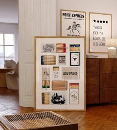 a room with wooden floors and pictures on the wall next to a dresser in front of a window