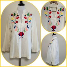 "For your consideration Vintage floral embroidered tunic top. I think it is from the 60s but can't say for sure. The original owner did a lot of traveling over many decades. Feels like cotton and fits like a modern S/M. Nice piece. Good lookin! Pre owned, shows general wear. Overall nice condition. Has faint age discoloration in areas and minor snags on the embroidery. Minor fraying. Has not been recently cleaned but I did heat steam it. Please review photos and message with any questions Measur Casual Cotton Tunic With Floral Embroidery, Cotton Tunic With Floral Embroidery For Spring, Spring Cotton Tunic With Embroidered Hem, Multicolor Embroidered Cotton Top With Boho Collar, Cotton Tops With Multicolor Embroidery And Boho Collar, Traditional Cotton Tunic For Spring, Spring Cotton Tunic With Multicolor Embroidery, Casual Cotton Tunic With Embroidery, Multicolor Embroidered Cotton Tunic Blouse