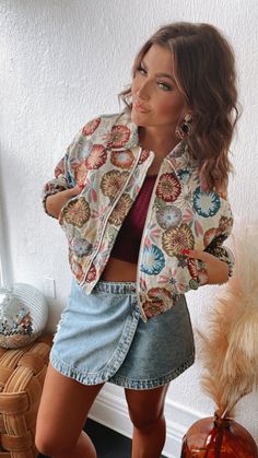 A statement piece! Make a statement wherever you go in our Full Of Color Floral Print Tapestry Cropped Jacket! This jacket is featured in a retro floral print with a cropped fit and collared neckline. This jacket is going to be your GO TO this fall! Retro floral printed jacket Tapestry cropped jacket Collared neckline Zip up front Elastic bottom Elastic Cuffs Lined Fabric: 70% Cotton, 30% Polyester Measurements: Measured lying flat S: Bust: 41 1/4” | Length: 19 1/4” M: Bust: 42” | Length: 20 1/4” L: Bust: 42 1/2” | Length: 21 1/4” Model Specs: Karli + Emily are wearing a size small in the photo.How will this item fit you? Check out our MODEL SPECS (Typical Sizing - Karli: S-Size 5/26 - 5ft 2in, Emily: S-Size 3/25 - 5ft 5in, Syd: L/XL- Size 15/ - 5ft 8in)Need help with sizing? No problem! J Vintage Printed Outerwear For Spring, Fall Floral Print Multicolor Embroidered Outerwear, Fall Floral Print Outerwear With Multicolor Embroidery, Fall Multicolor Embroidered Floral Outerwear, Fall Outerwear With Multicolor Embroidery And Floral Print, Vintage Outerwear With Floral Patchwork, Bohemian Floral Print Outerwear, Trendy Cotton Outerwear With Floral Print, Spring Multicolor Floral Patchwork Outerwear