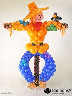 a balloon sculpture made to look like a scarecrow with balloons on it's legs