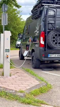 an electric vehicle plugged in to a charging station