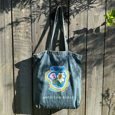 Rare American Eagle Denim Graphic Tote Bag. Super Cute For Back To School. Never Used, Brand New With No Tags. Standard Tote Bag Made Of Denim/Jean Material With Cute Graphic In Front. Unlined, No Interior Pockets. Length: 18 Inches Width (Opening) 16 Inches. Graphic Tote Bag, Eagle Graphic, Jean Material, Bag Art, Print Denim, Denim Tote Bags, Denim Tote, Graphic Tote, Jeans Material