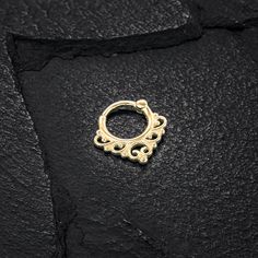 "A unique septum ring with a tribal design, this 14k solid gold hoop is perfect for adding a bit of edge to your outfits. The hoop features a durable clicker mechanism that makes it easy to insert and remove. Material: * 14k solid gold - available in yellow gold, rose gold, or white gold. * Closure type: clicker Measurements: Inner diameter: 8mm - 0.32\" Wire thickness: 1.2mm - 16g *Nickel- free For more septum rings: https://etsy.me/3tkxmgL Check out our shop: https://www.etsy.com/shop/Umanativ Hoop Septum Piercing, Nose Ring Online, Unique Septum, Gold Septum Ring, Hoop Septum, Unique Nose Rings, Gold Septum, Septum Hoop, Septum Rings