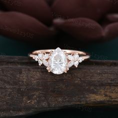 Pear shaped moissanite engagement ring Rose gold butterfly engagement ring Vintage marquise diamond cluster ring Art deco bridal gift ● Ring information: --main stone: moissanite --stone size & shaped: 6*8mm & pear cut --side stones: moissanite/diamond 0.25ct ● Optional service: --personalized order --rush order & overnight --installment --engraving --gift box Please consult us for details ● Production and shipping time: We usually make the ring and arrange the delivery within 7 days, the logist Pear Shaped Cluster Engagement Ring, Moissanite Ring Pear, Engagement Ring Butterfly, Marquise Rings Engagement, Engagement Rings Butterfly, Butterfly Engagement Rings, Pear Cut Ring Engagement, Butterfly Wedding Rings, Almond Shape Ring