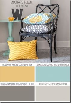 a chair with yellow and blue pillows in front of it, next to a shelf