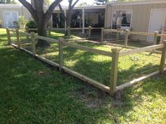 a wooden fence in front of a house