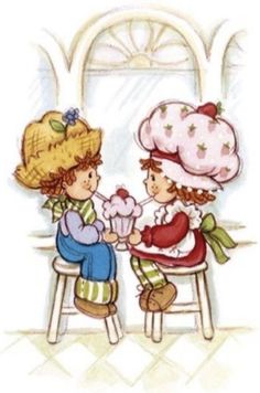 two children are sitting on stools and one has a cupcake in her hand