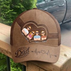 This classic cap is a quintessential accessory for any dad, especially as a Father's Day gift. It boasts a "Best Dad Ever" inscription alongside a heart rate graphic, symbolizing the love and vitality he brings to the family. The cap's unique feature is the personalized section above the visor, where caricatures of children's faces can be placed, each labeled with their names. It's a fashionable and practical way for any father to show off his pride and joy while keeping cool in the sun. MESSAGE Father's Day Gift Trucker Hat With Curved Brim, Father's Day Gift Snapback Hat With Curved Brim, Brown Flat Bill Baseball Cap For Gift, Personalized Hats For Father's Day, Curved Brim Baseball Cap For Father's Day, Flat Bill Hats For Father's Day Gift, Adjustable Hats As Father's Day Gifts, Letter Print Hat For Father's Day Gift, Personalized Baseball Cap For Father's Day