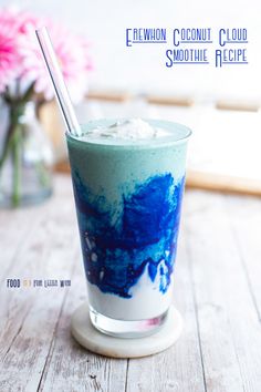 a blue and white drink sitting on top of a wooden table