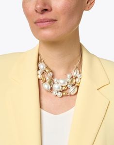 Deborah Grivas is known for her uniquely ornamented jewelry, contrasting matte knotted leather with enchanting stones and beads. Made in the United States, this multi-layered necklace is strung with varying white pearls and gold beads. It is designed to rest comfortably at your collarbone, and features an adjustable silver-plated lobster claw closure. Wear to elevate an understated blouse or sweater. Armani White, Skirt And Top Dress, Work Accessories, Multi Layer Necklace, Gold Bead Necklace, Beautiful Color Combinations, Scarf Jewelry, Contemporary Jewelry, Leather Necklace