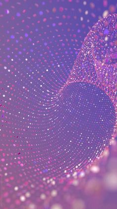 an abstract background with many small dots in the center and pink, purple, and blue hues