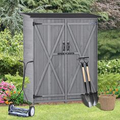 a garden shed with two shovels and gardening implements