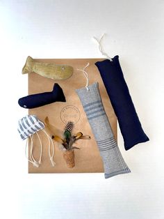 various items are laid out on a piece of brown paper and placed on top of each other