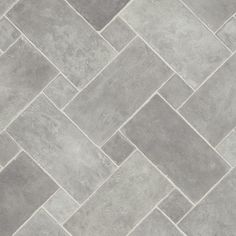 a tile floor with grey and white tiles on the top, one is diagonally arranged