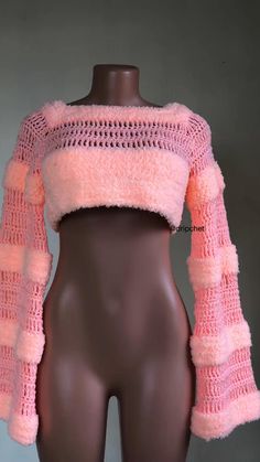 a female mannequin wearing a pink sweater