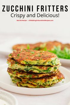 zucchini fritters on a white plate with text overlay that reads zucchini fritters crispy and delicious