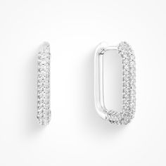 Leave a lasting impression with these dazzling Cocktail Earrings! Whether you're out on the town or brunching with the girls, these chic, classy, and dainty square hoops - complete with sparkling stones - are sure to be a showstopper. Look no further for your perfect accessory - these earrings are glam for all occasions! Modern Small Hoop Cubic Zirconia Earrings, Modern Cubic Zirconia Small Hoop Earrings, Rectangular Cubic Zirconia Earrings With Diamond Accents, Rectangular Cubic Zirconia Earrings, Elegant Rectangular Sterling Silver Hoop Earrings, Elegant Sterling Silver Rectangular Hoop Earrings, Elegant Square Huggie Earrings, Chic Cubic Zirconia Earrings With Diamond Accents, Rectangular Prong Setting Earrings