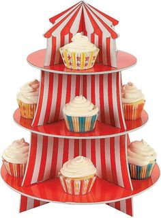 three tiered cupcake display with red and white striped umbrellas on each side