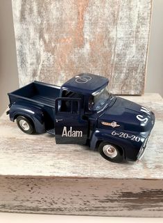 a toy truck with the name adam on it