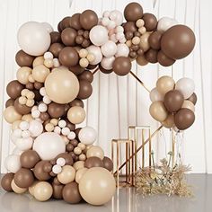 an arch made out of balloons on top of a table