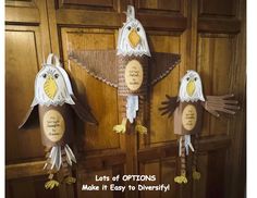 three paper mache birds hanging on the front door with words written in each one