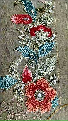 an embroidered piece with flowers on it