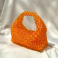 🌟 Orange Crystal Beaded Clutch 🌟 🧡This handmade elegant and unique clutch will add sparkle to your special moments like weddings and events! Designed with the enchanting sparkle of orange crystal beads, this clutch will reflect your elegance and style in your most special moments. 🧡Each bead has been meticulously selected and crafted to bring you perfect elegance and quality. 🧡This clutch is designed to complement any style and occasion. Whether for special events or daily use, this clutch Beaded Pouch Evening Bag As Gift, Beaded Pouch Evening Bag For Gift, Handmade Orange Evening Bag, Unique Clutch, Hand Beaded Bag, Beaded Clutch Bag, Cloud Bag, Crystal Bags, Bead Charms Diy