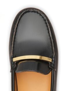 These loafers are like the sleek, stylish friend who’s always up for a spontaneous adventure, thanks to their comfy fit and effortlessly chic vibe. Crafted in Italy, they're the perfect blend of elegance and casual charm, making them a must-have for any wardrobe. You won’t just walk in these— you'll glide. Black calf leather with a patent finish Sleek silver-tone hardware Detailed tonal stitching Unique apron toe design Chic square toe Signature Gommino rubber sole for comfort Black Patent Leather Loafers, Patent Leather Loafers, Black Leather Loafers, Leather Cap, Footwear Design Women, Black Patent Leather, Handbag Backpack, Flat Shoes, Leather Loafers