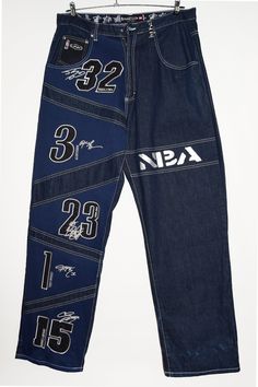 Score major style points with our UNK Denim Jeans! These NBA Embroidered Basketball Pants aren't your average baggy jeans--think streetwear cool with embroidered basketball magic. With vintage vibes and team patchwork flair, you'll be slam-dunking in the fashion game. Perfect for reppin' your squad with swag! 🏀🕶️ - Size tag:  Size 36. - Measurements (laying flat): Please always check measurements before buying. Waist: 17.5" Outleg: 46" Inleg: 34" Thigh: 15" Rise: 13.5" Leg opening: 5" -9.5" -W Vintage Jeans With Double-needle Stitching For Streetwear, Vintage Patchwork Jeans For Streetwear, Streetwear Baggy Jeans, Mid-rise Recycled Denim Pants For Streetwear, Basketball Shorts Streetwear, Vintage Basketball Shorts, Basketball Pants, Streetwear Jeans, Pants Vintage