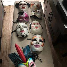 many masks are lined up on the counter