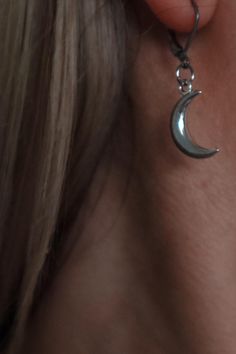 Stainless steel lever back earrings with silver plated crescent moon charms dangling. Size of moon: 2cm x 2cm Witchy Metal Jewelry With Moon Charm, Silver Moon Shaped Witchy Jewelry, Silver Moon Cartilage Earring, Silver Crescent Cartilage Earrings With Moon Charm, Silver Moon-shaped Single Cartilage Earring, Sterling Silver Crescent Cartilage Earrings With Moon Charm, Silver Moon Charm Drop Earrings, Silver Cartilage Earrings With Moon Charm As Gift, Silver Drop Earrings With Moon Charm