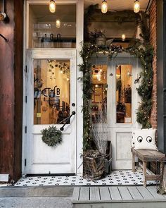 the front door of a store decorated for christmas