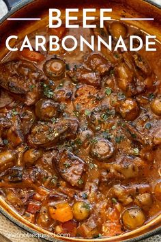 beef and vegetable stew in a pot with text overlay that reads beef carbonnade