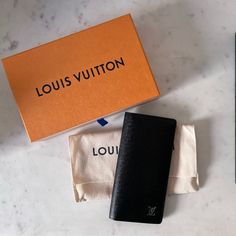 Brand New, Never Used, Taiga Leather With Chrome Monogram. Long Wallet. Purchased At Louis Vuitton Barcelona. Box, Dust Bag, And Cards Within The Wallet. Piping And Leather In New Condition. Luxury Black Wallets For Daily Use, Black Wallets For Everyday Use, High-end Black Wallet For Everyday Use, High-end Black Wallet For Formal Occasions, Modern Black Wallet With Dust Bag, Bags Louis Vuitton, Louis Vuitton Bags, Long Wallet, Louis Vuitton Bag