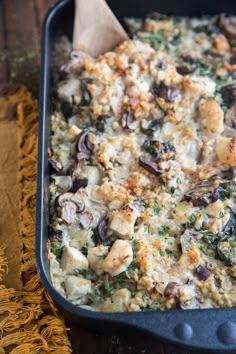 a casserole dish with mushrooms and other vegetables