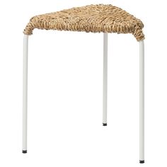 a wicker stool with white legs on a white background