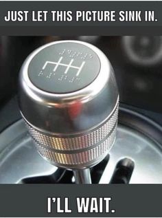 a close up of a metal object on a steering wheel with the words, just let this picture sink in