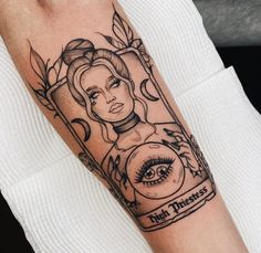 a woman's arm with a tattoo on it