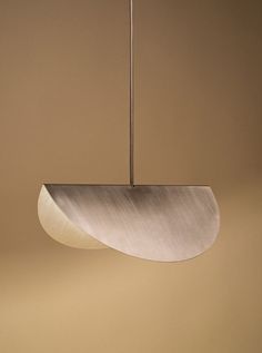 a modern light fixture hanging from a ceiling