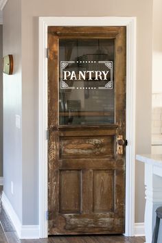 an old wooden door with glass on the front and side paneling in a house