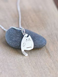 Thank you for visiting my store, you are looking at little cat pendant of silver. Cute cat made of sterling silver. The little cat is 24 мм/0.94 inches tall and 11мм/0.43 inches wide. Purchase will arrive to you with a black cotton thread. You can order the pendant with a cable chain. And you can choose the length of the chain by yourself to make this set perfect. Lovely pendant could be nice gift for someone special. Chain option: 40 cm / 16 inches, 45cm / 18 inches, 50cm / 20 inches,  55cm / 2 Cat Charm Necklace, Silver Cat Pendant, Cat Necklace Silver, Kitty Necklace, Tiny Necklace, Necklace Cat, Sterling Silver Cat, Cat Pendant, Charm Necklace Silver